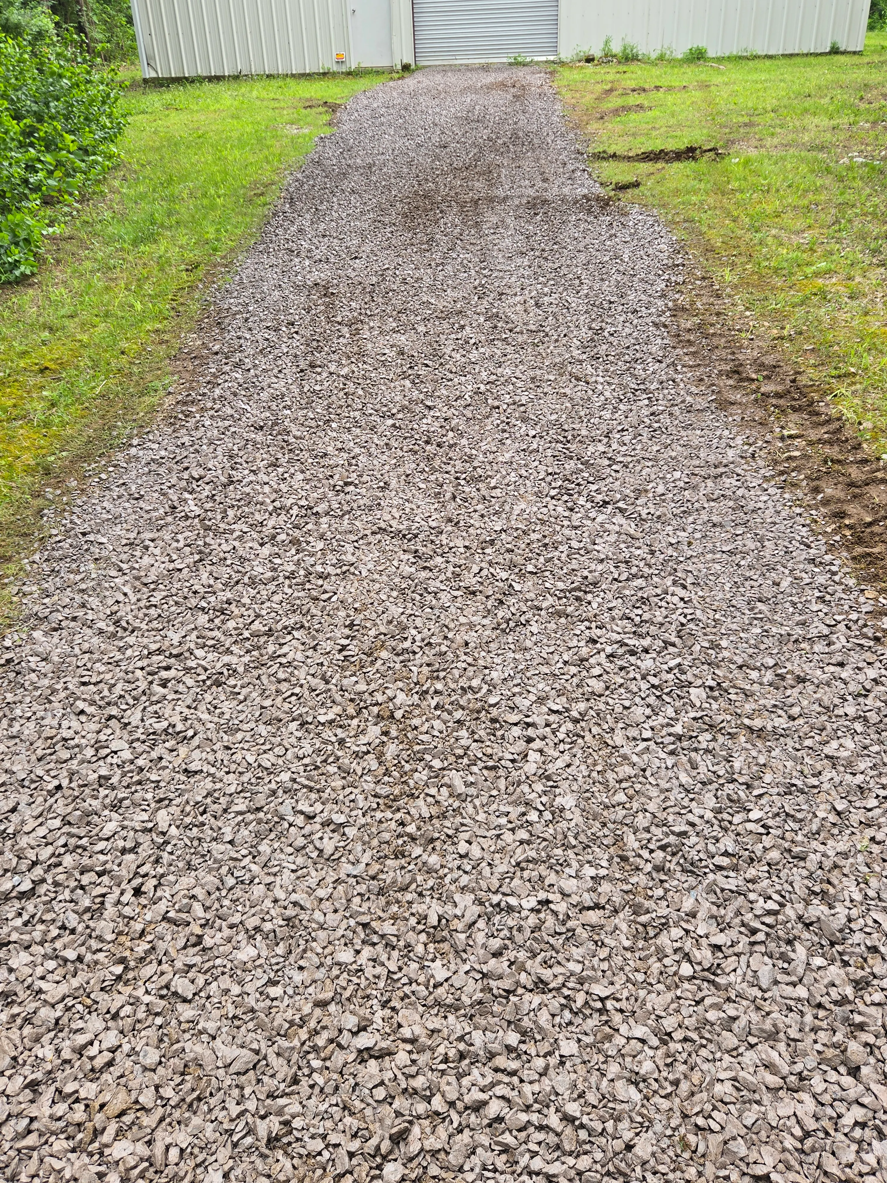 Gravel driveway after regrading and resurfacing