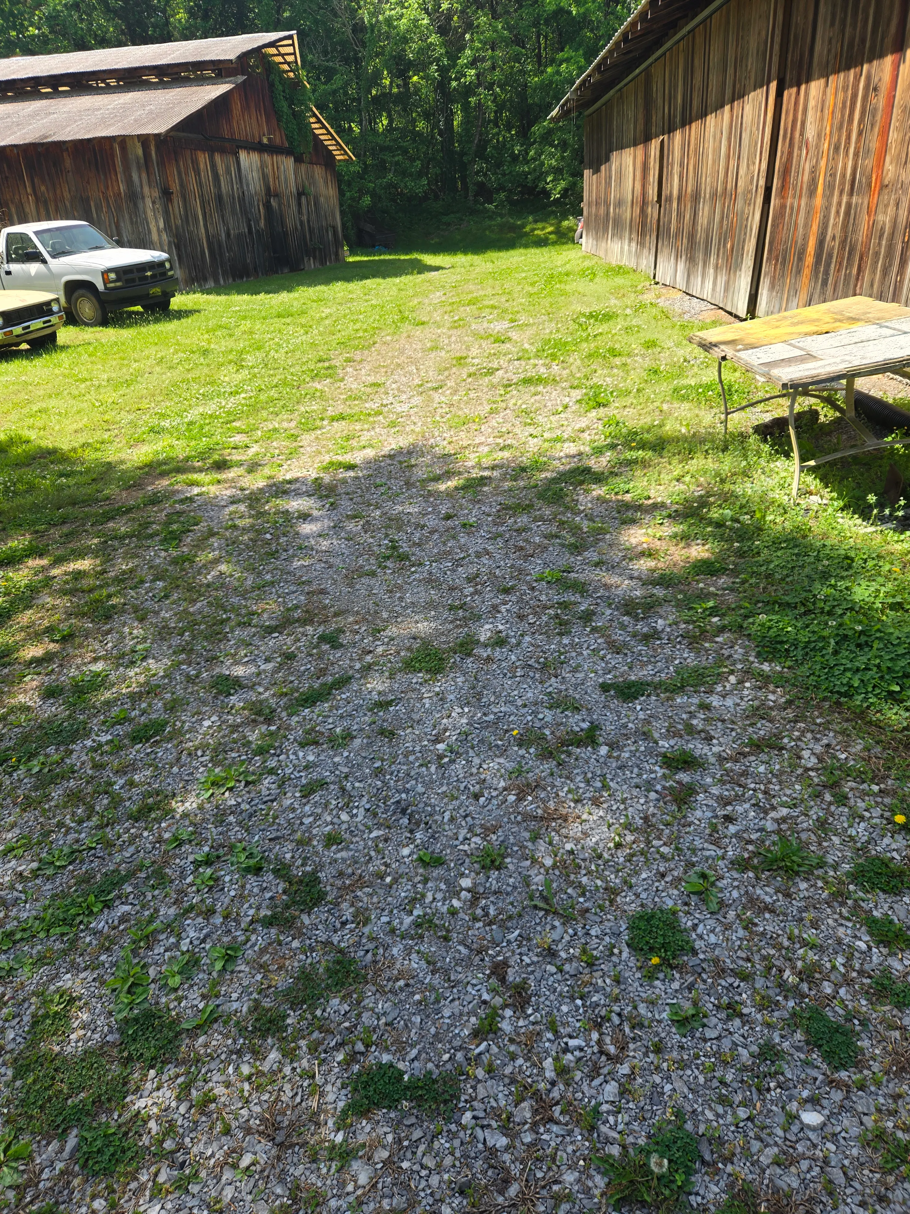 Gravel driveway before resurfacing and cleanup work